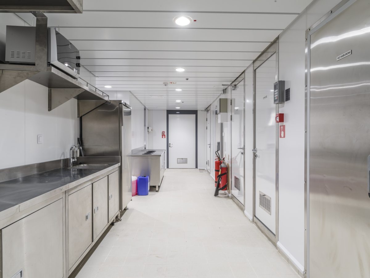 Accomar Marine Commercial Galley Corridor With Stainless Steel Workstations