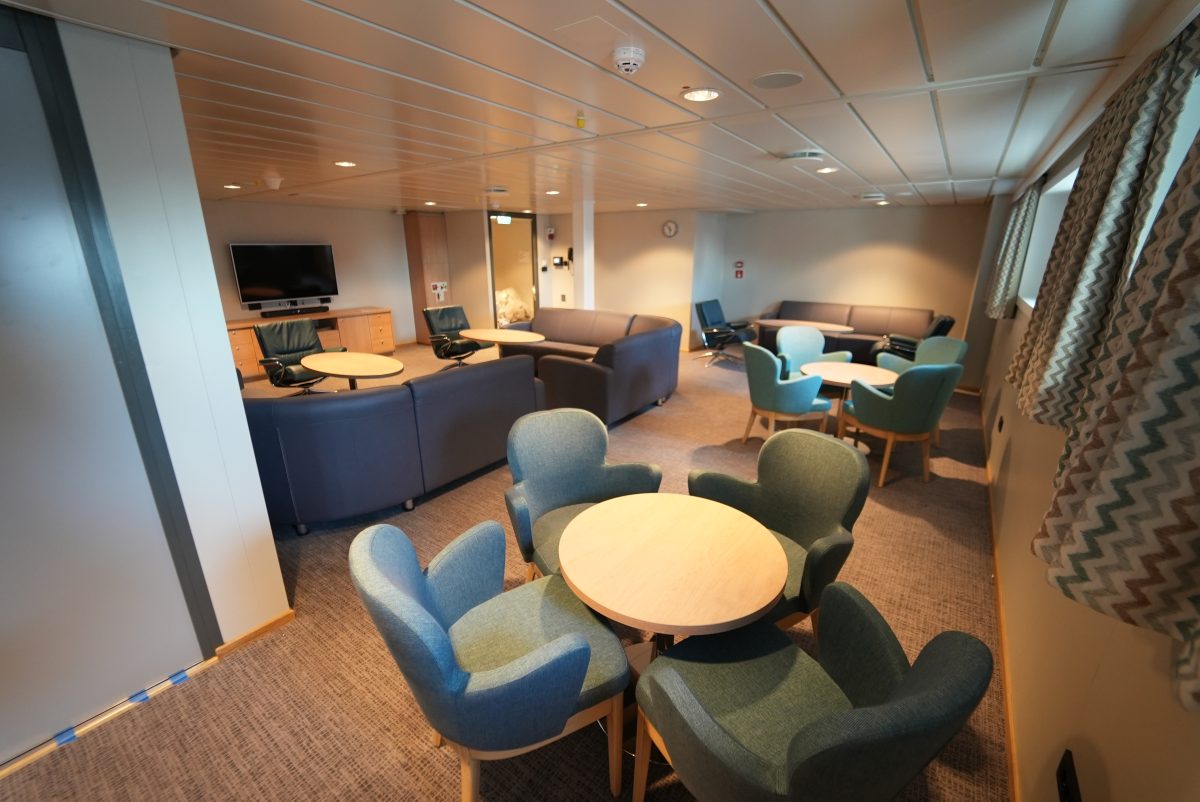 Accomar Marine Lounge Area With Modern Seating And Round Tables
